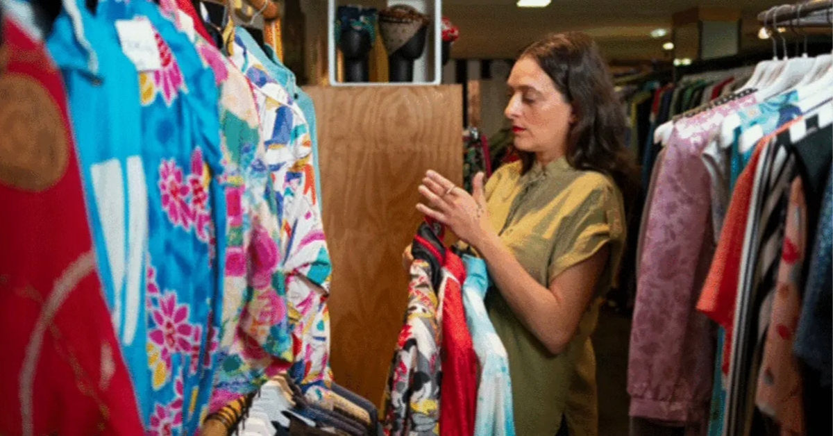 A woman selecting Pakistani clothes from a retail shop in Dubai