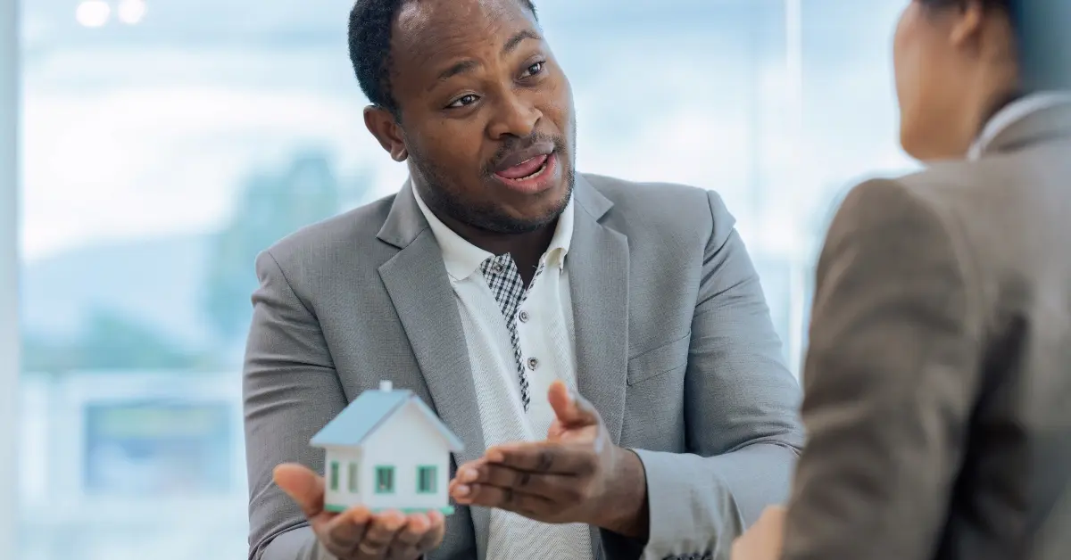 Real estate agent and client talking about property insurance and security