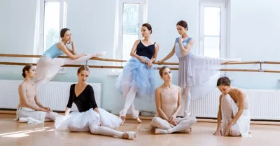 The seven ballerinas at the ballet bar