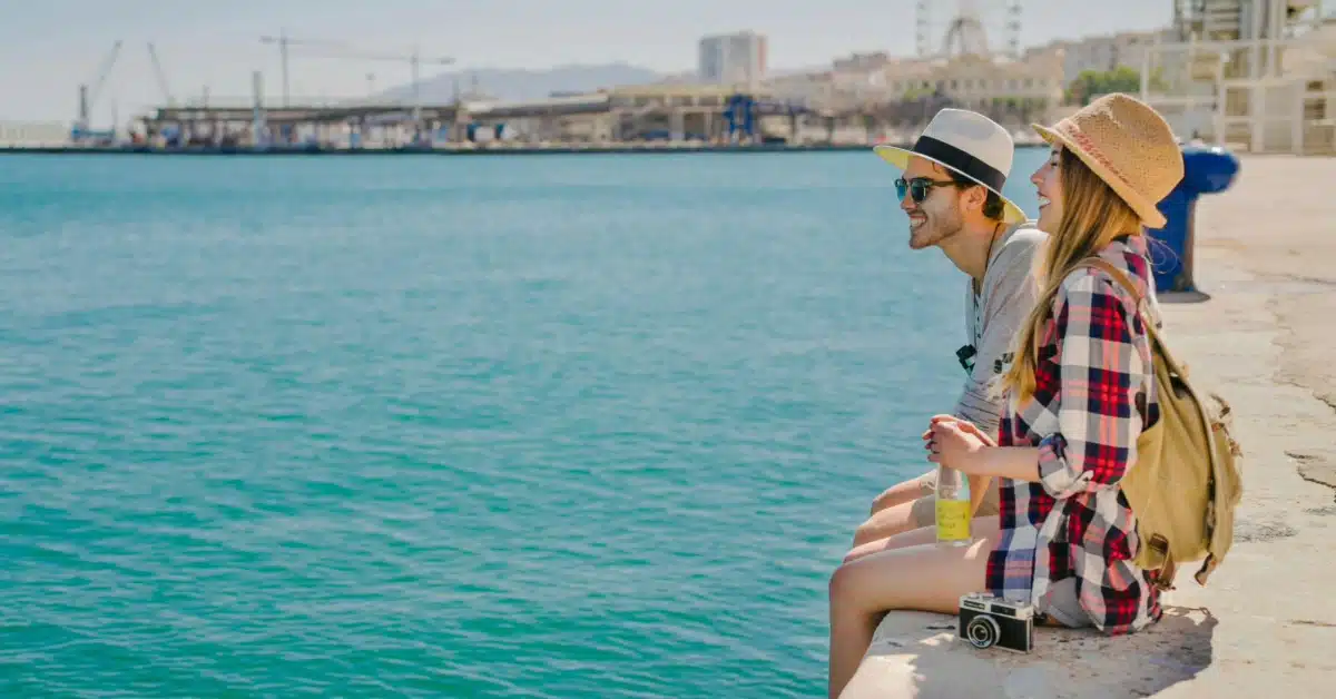 Tourist sitting peacefully near the coast, enjoying the seaside view