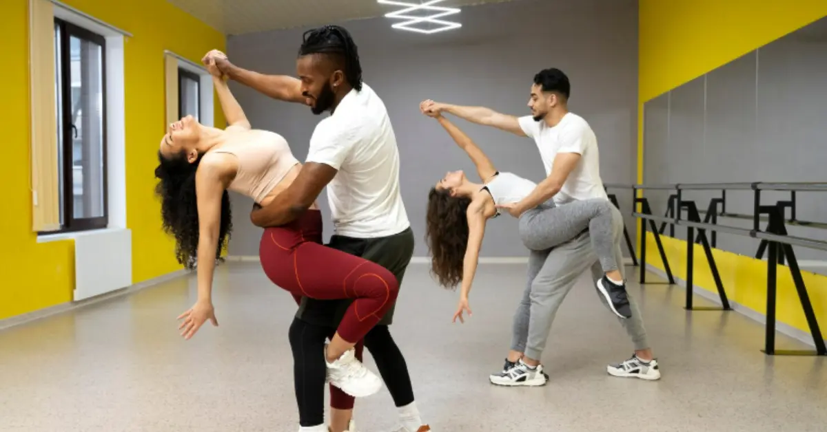 Two couples performing the same pose