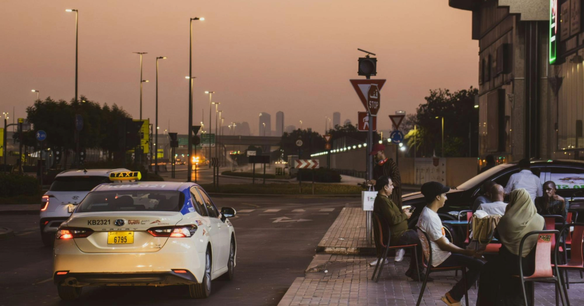 A blue-roofed taxi in a residential area
