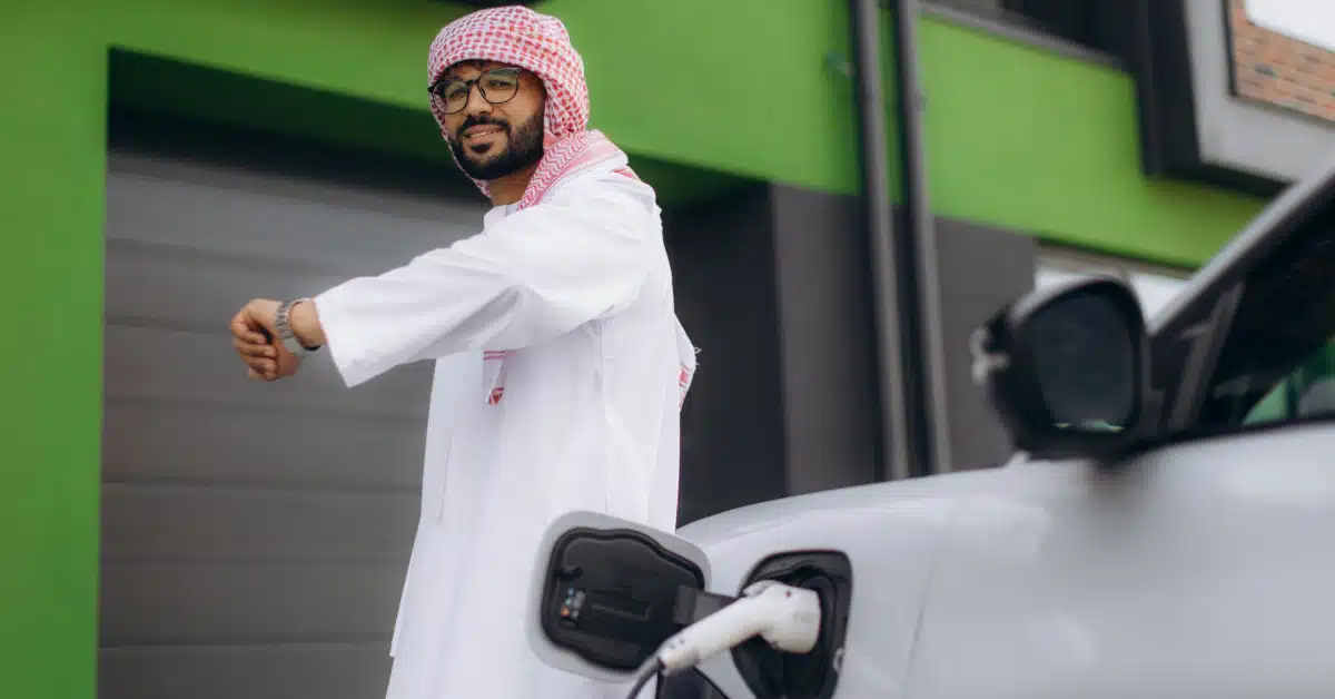 Man charging his electric car