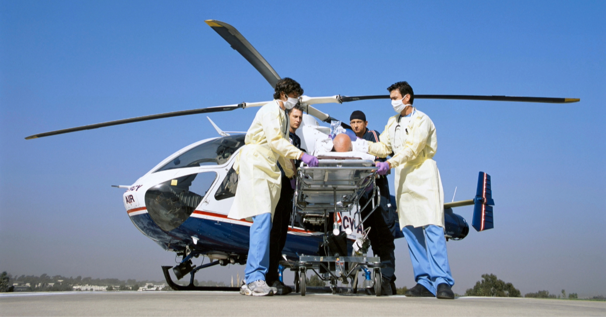 A serious patient being rushed by doctors and paramedics from the emergency airlift