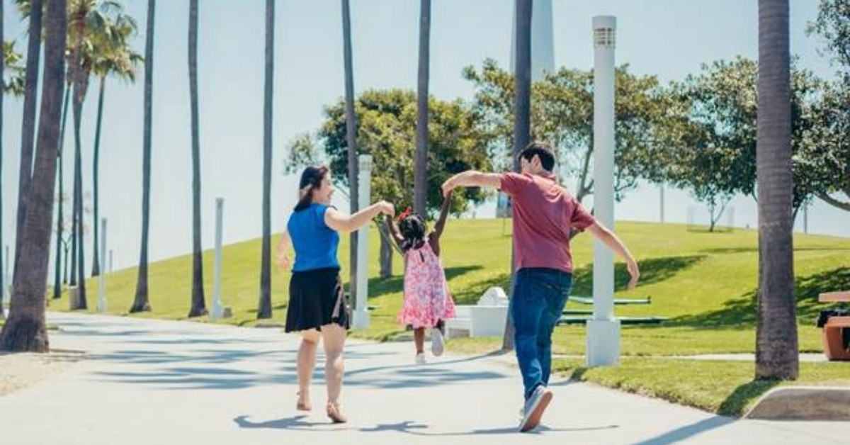 A family walking in a park in Abu Dhabi