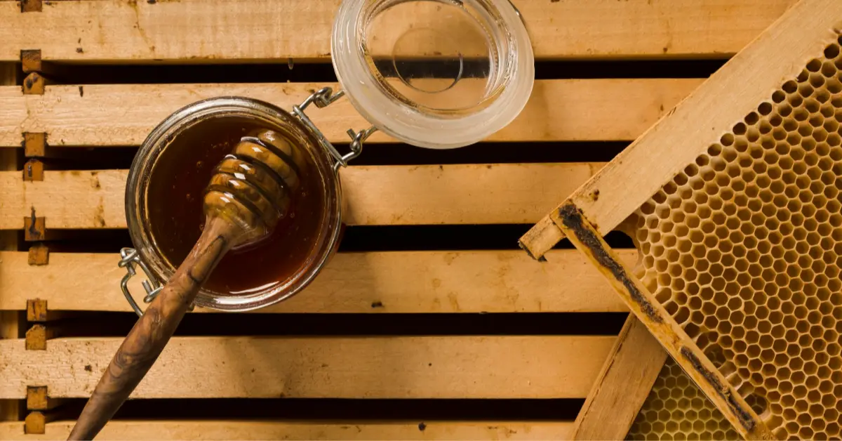 Top view glass jar full of honey