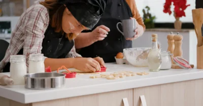 A woman using a cookie cutter in a baking class in Abu Dhabi