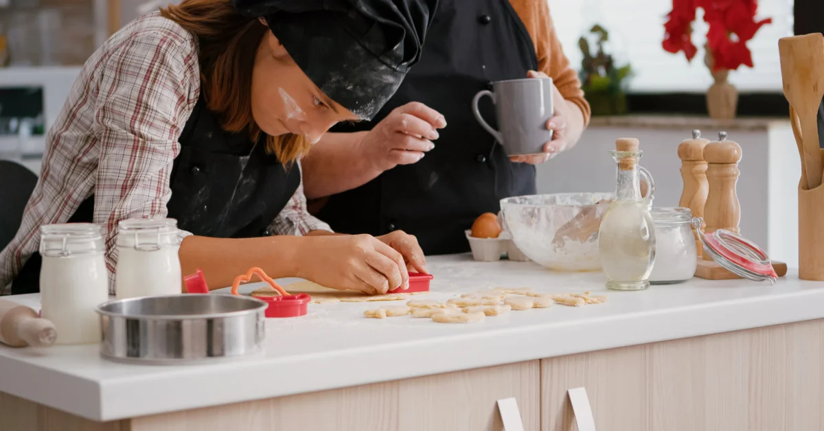 A woman using a cookie cutter in a baking class in Abu Dhabi
