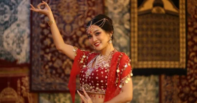Young Indian woman doing bollywood dance move