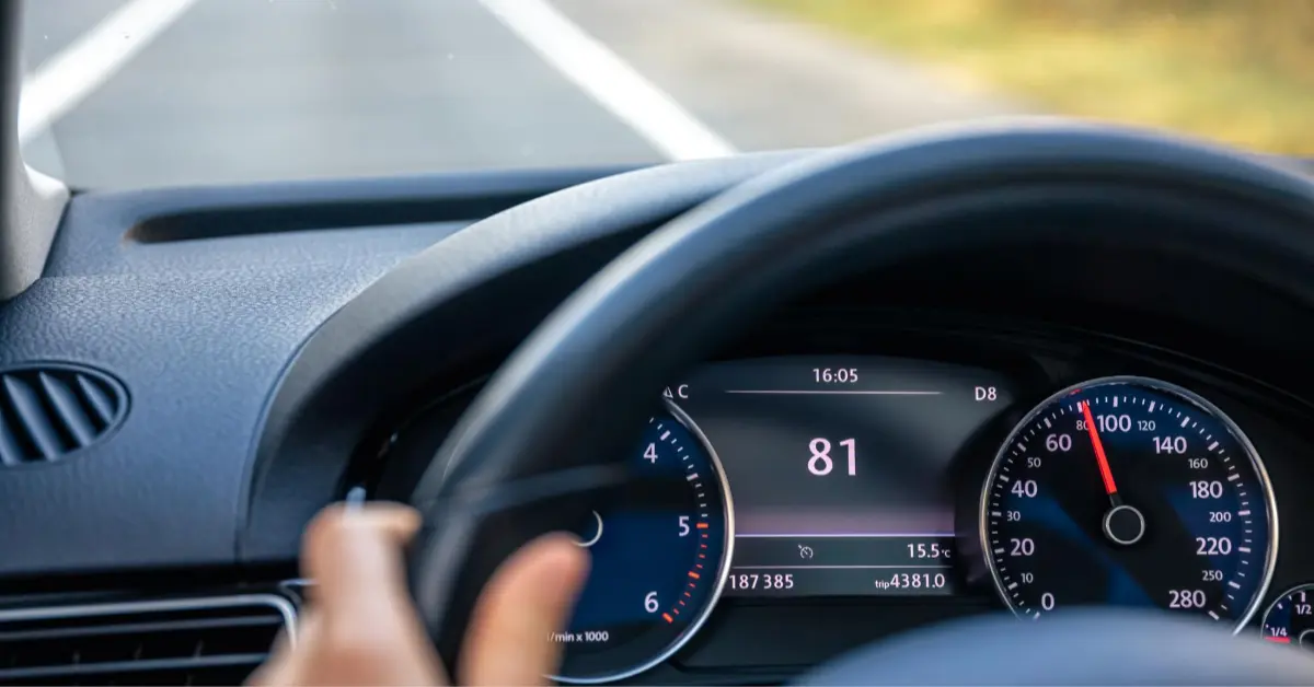Steering wheel in a car close up high speed driving on the road