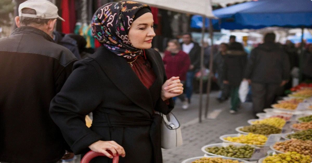 A woman purchasing items from discount stores in Sharjah