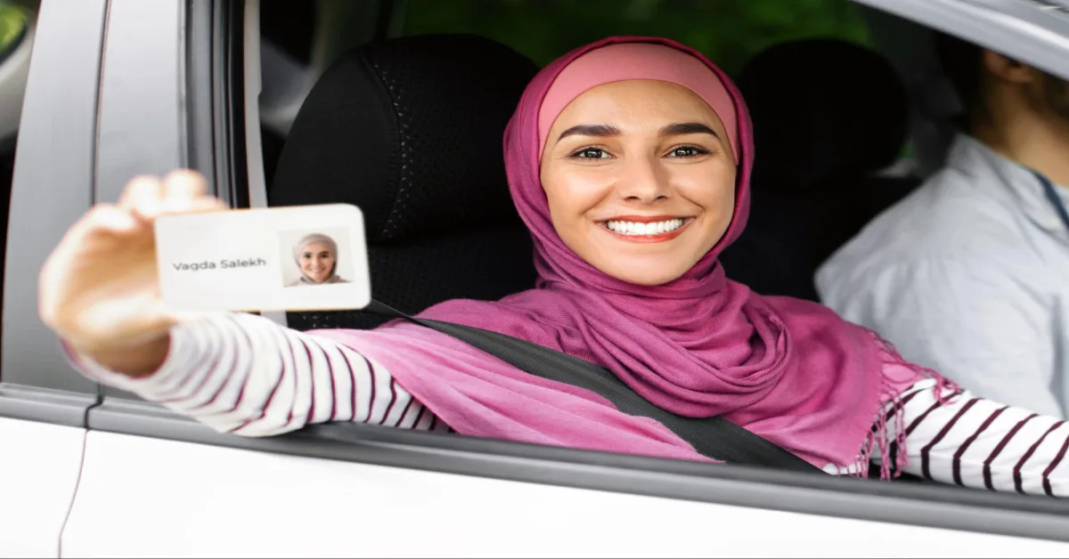 A woman showing her driving license 