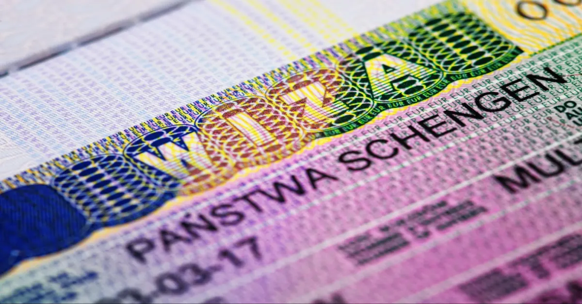 Macro photo of Schengen visa stamp in a passport