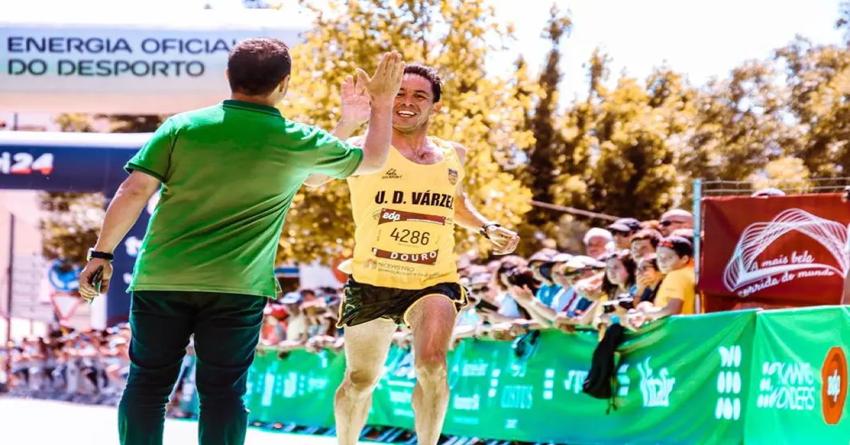 People celebrating crossing a marathon finish line