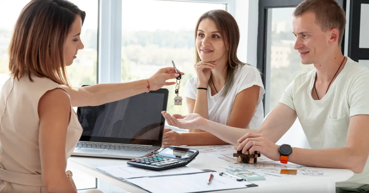 Couple accepting the keys for their new house