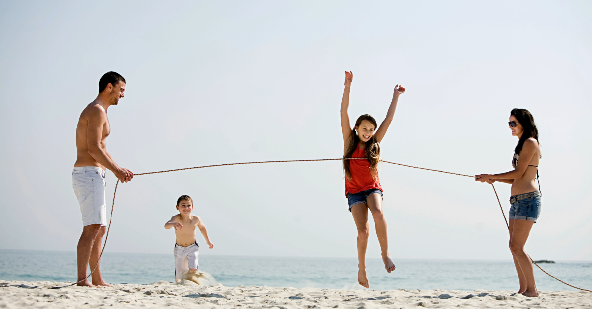 Family playing&nbsp; on a beach