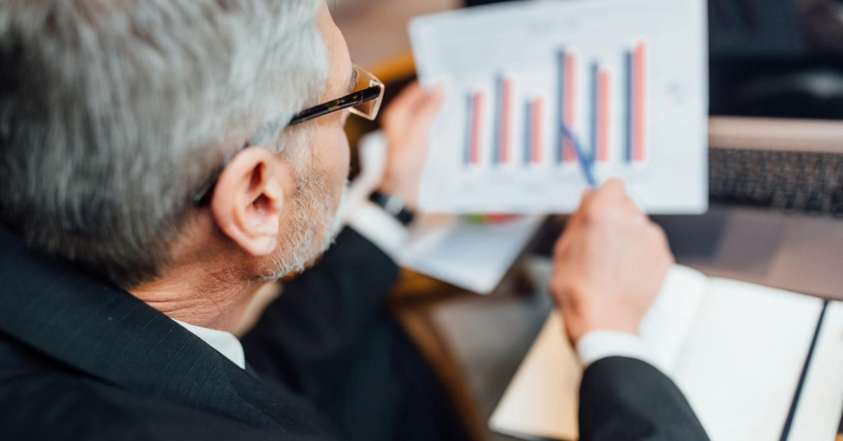 A man reviewing the market analysis during a meeting.
