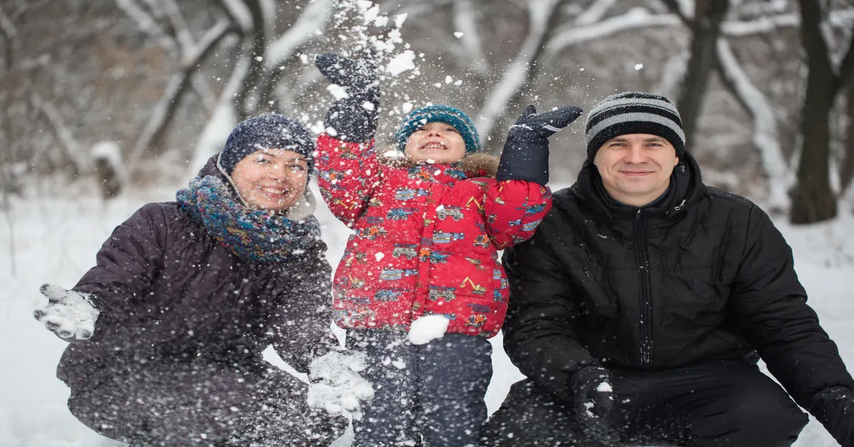 Family playing in the snow area
