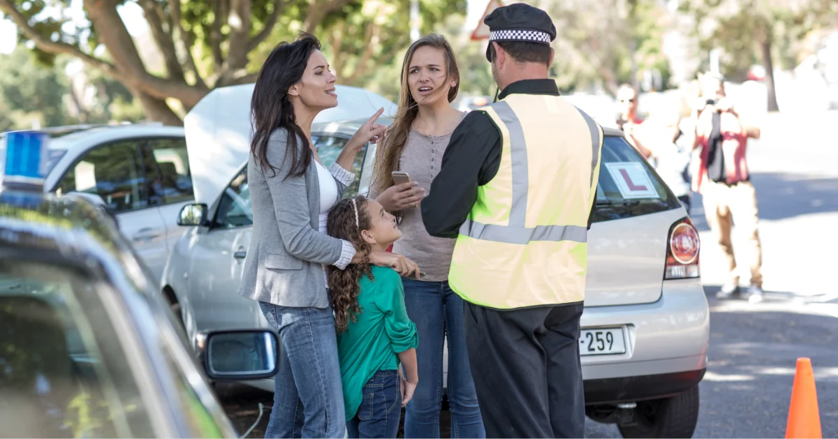 people and police man at car accident in Al Wasit, Sharjah 