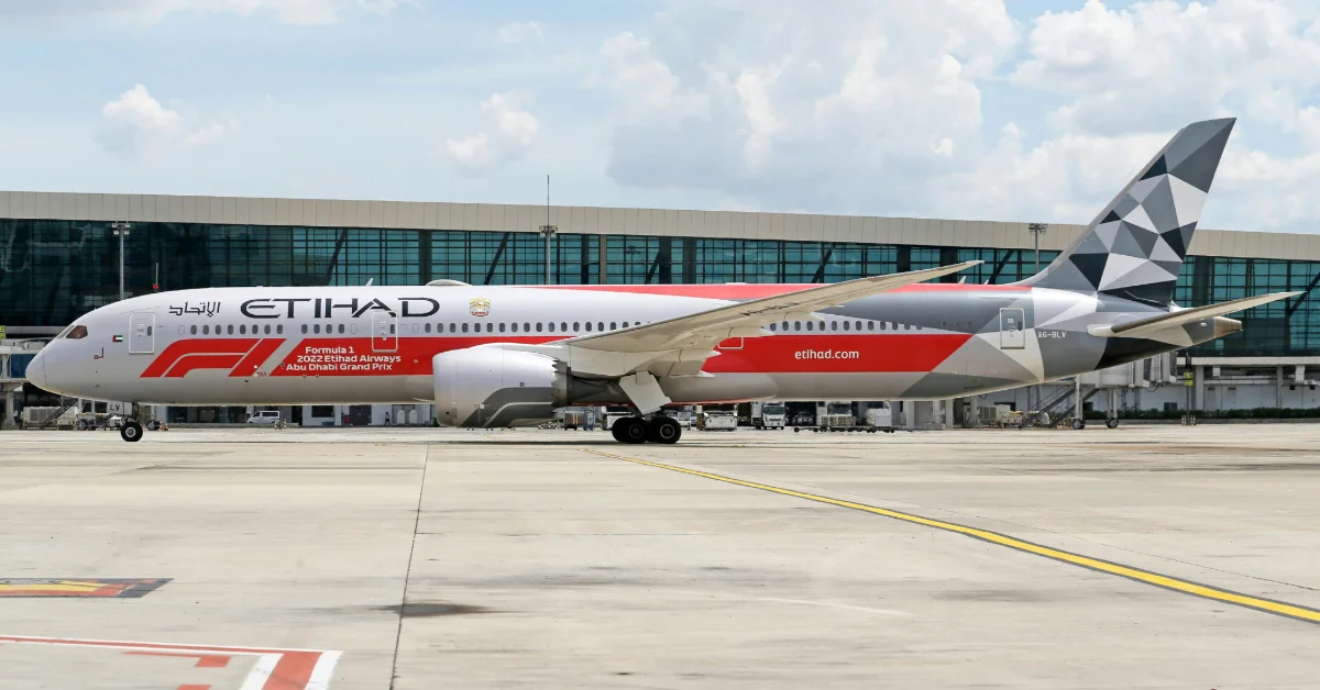 A plane standing on the runway of Zayed International Airport