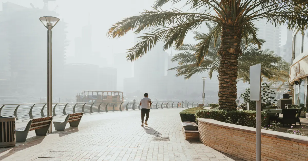 Someone walking to Burj Khalifa