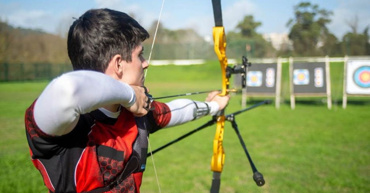 A man practicing archery in an outdoor range in Dubai