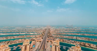 Tall buildings with a cloudy sky above Palm Jumeirah