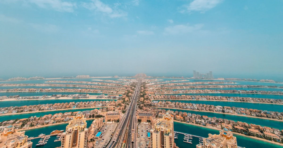 Tall buildings with a cloudy sky above Palm Jumeirah