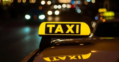Night shot of a taxi with its illuminated sign glowing