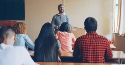 A teacher addressing a classroom of students
