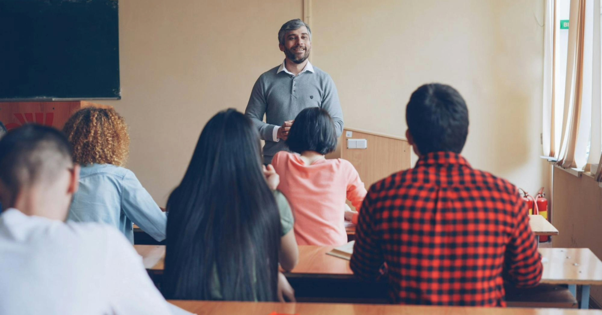 A teacher addressing a classroom of students