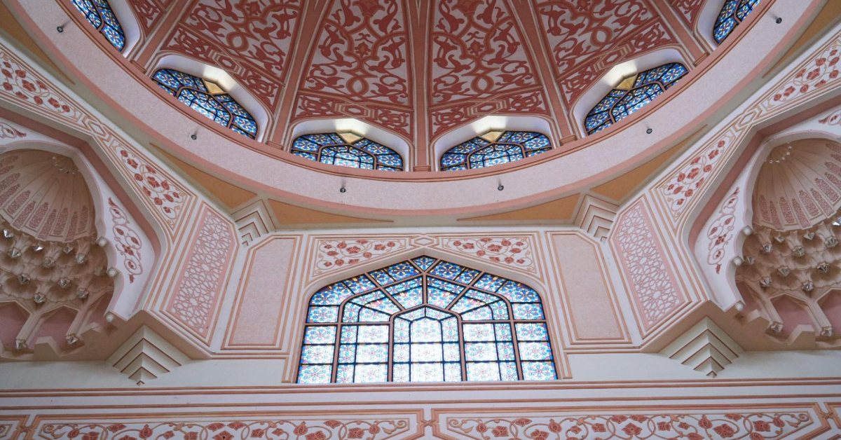 A low-angle shot of the mosque’s upper structure