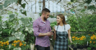 A man inquiring about a plant