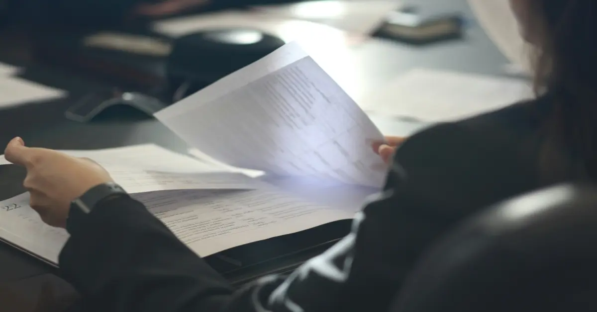 A woman sorting her documents