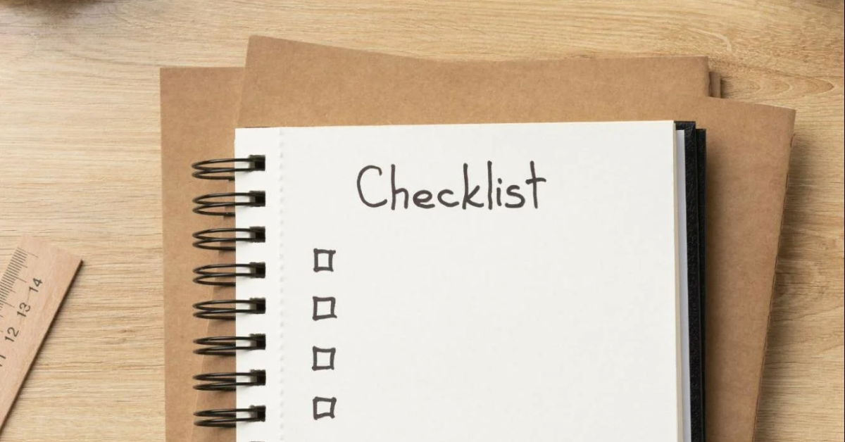 A page in a notebook containing a checklist with a few tick boxes.