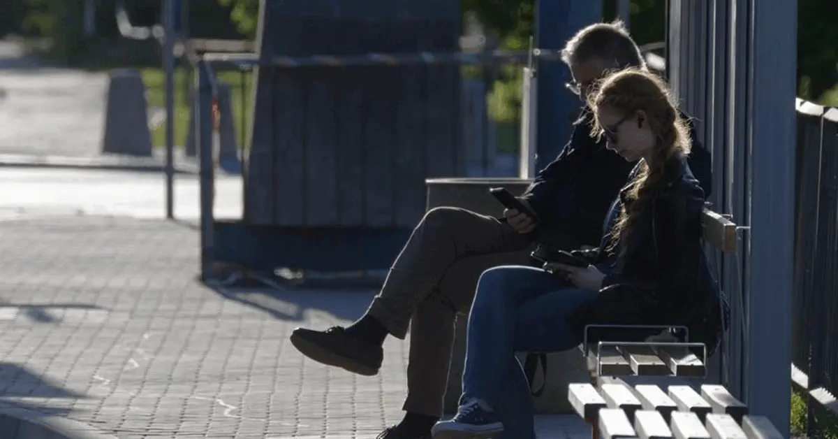 People waiting outside at the Al Qusais bus stop