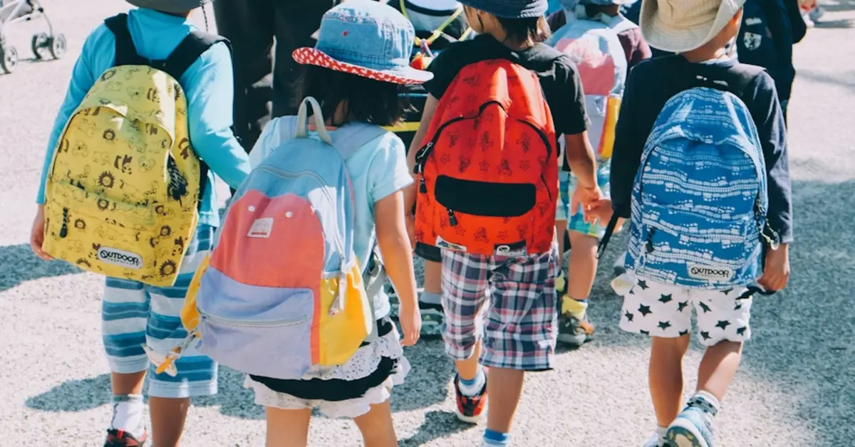 Children lined up and walking in pairs