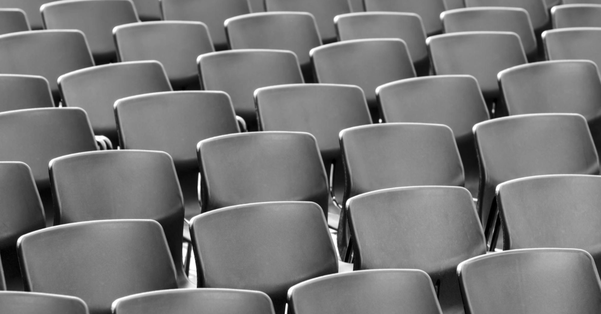 Grey chairs arranged neatly in a row