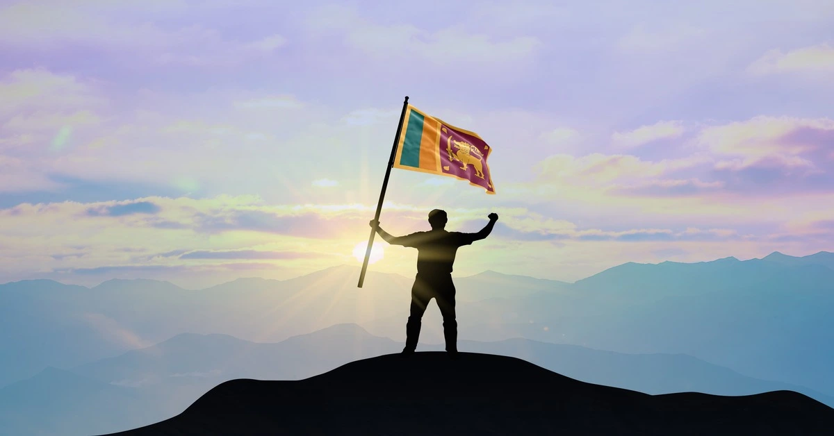 A Man Waving the Flag of Sri Lanka