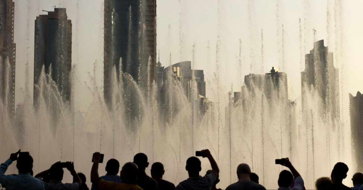 People filming the Dubai fountain during the day