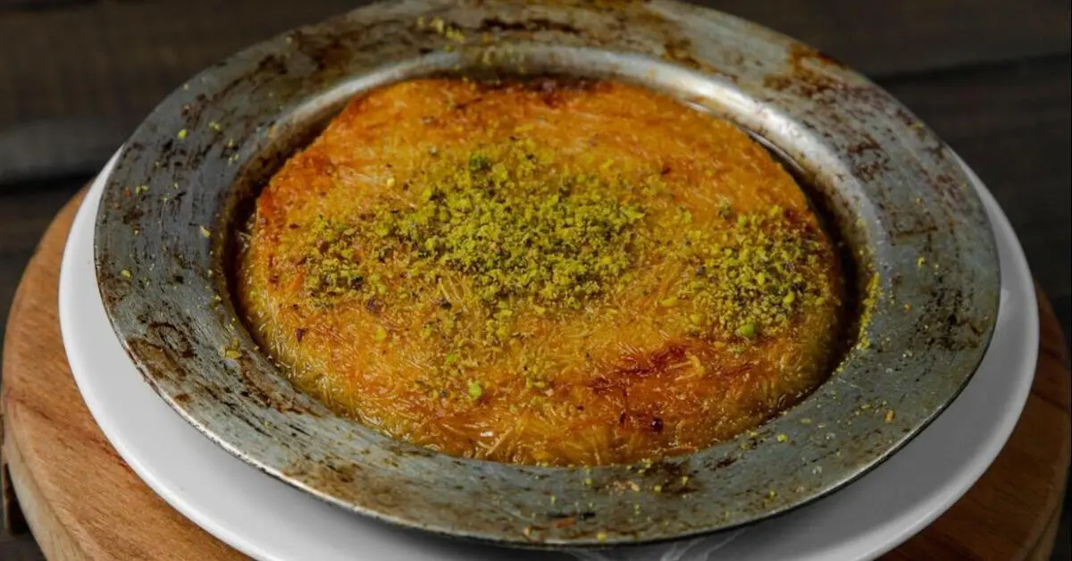 Turkish dessert Kunafa topped with pistachio