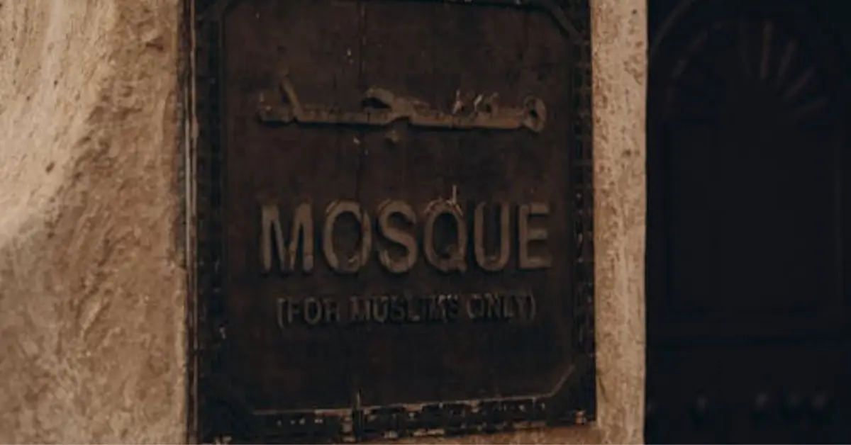 Vintage Sign on Historic Dubai Mosque Wall