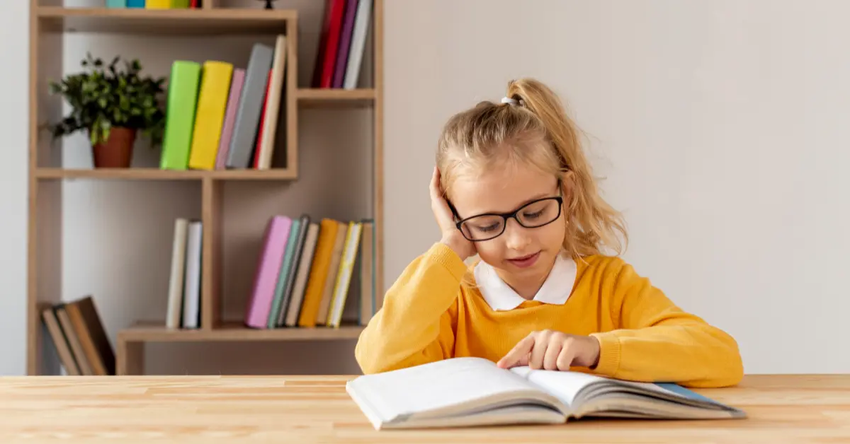 A child reading a book after school