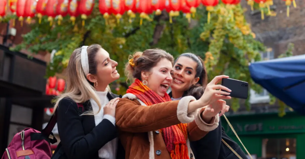 A group of friends clicking pictures in celebration of the Chinese New Year