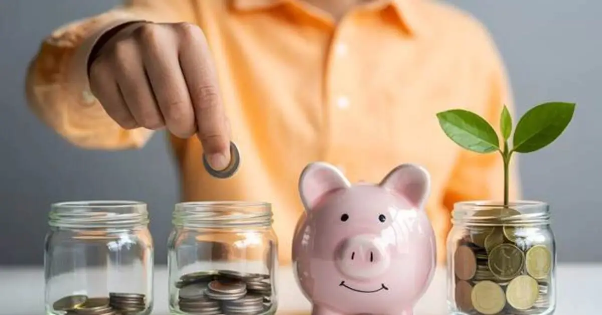 A man putting coins in jars to save them