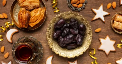 Table decorated with Ramadan decorations and dates with tea