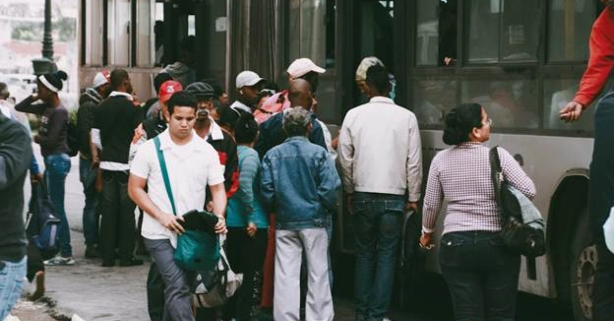 People waiting to get on the X13 bus in Dubai