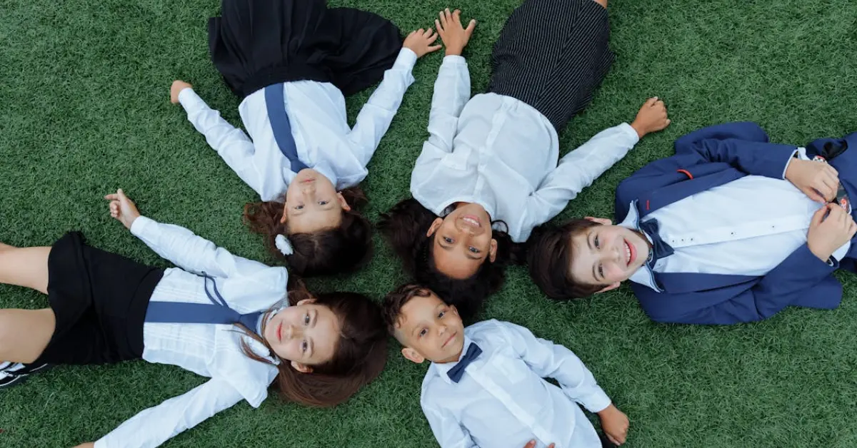 kids lying down on grass during recess
