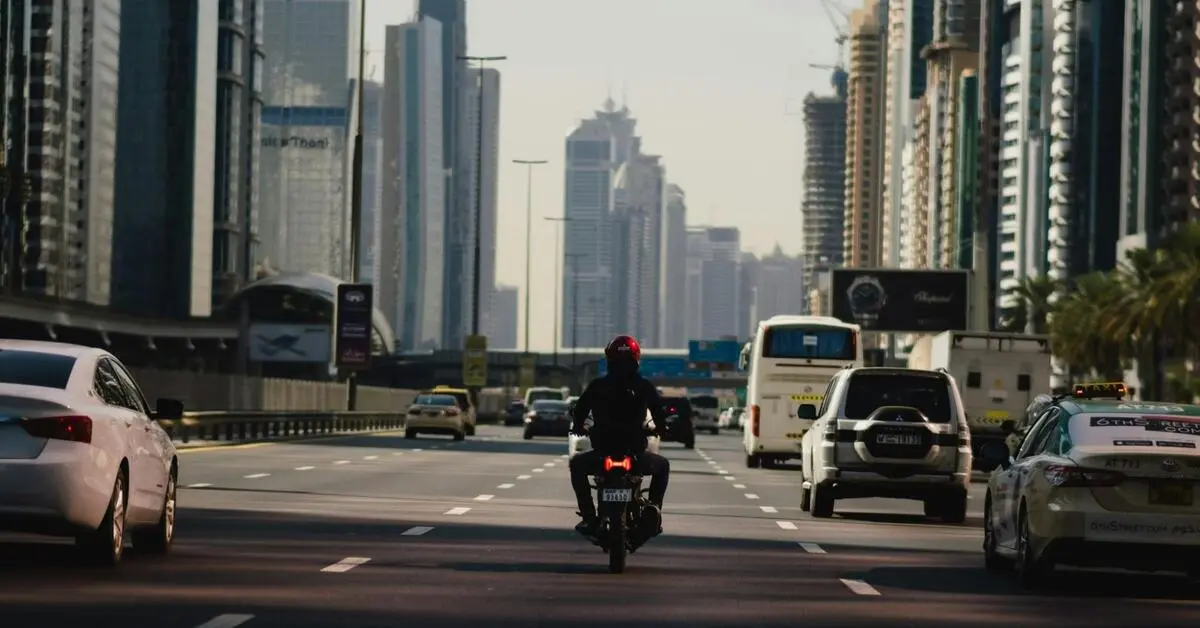 A man riding his motorcycle along the streets of Dubai