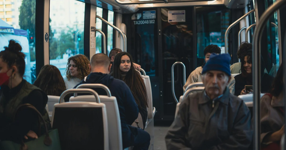 Passengers sitting inside the Abu Dhabi Link bus
